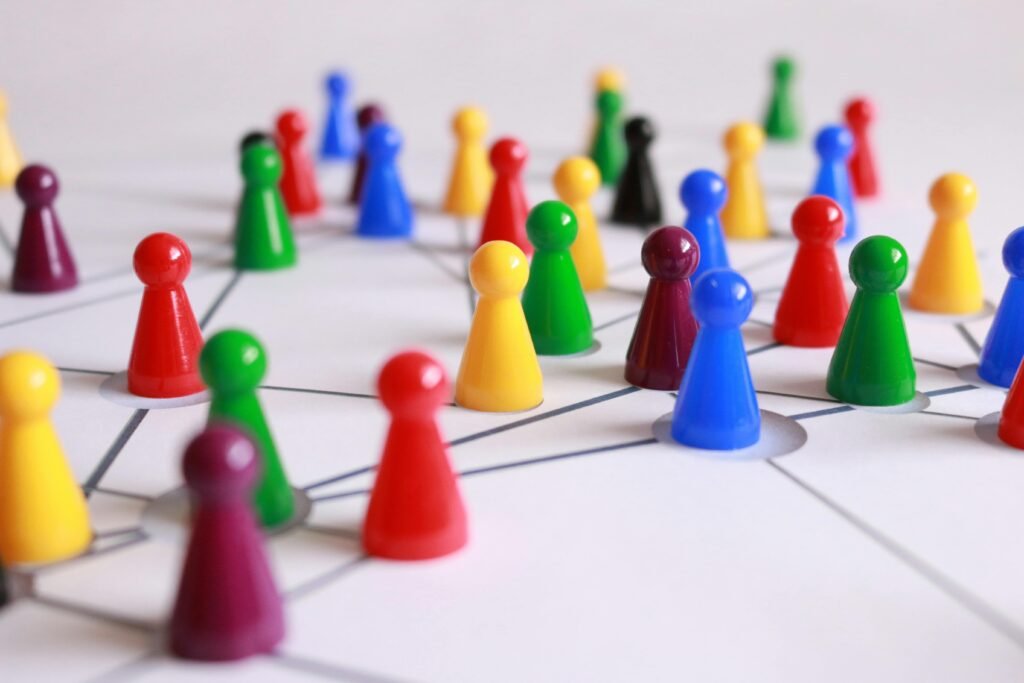 play-stone-network-networked-interactive-163064-163064 A strategic arrangement of colorful pawns connected on a game board, symbolizing networking and teamwork.